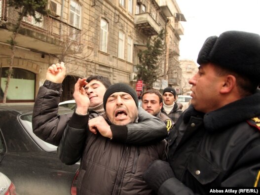 Youth activists are corraled by police in Baku on March 11, when Facebook activists called for 'Great People's Day.'