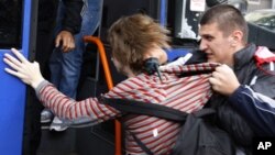 A plainclothes policeman detains a protester in Minsk in June 2011, six months after demonstrations following a flawed presidential election sparked a new wave of repression.