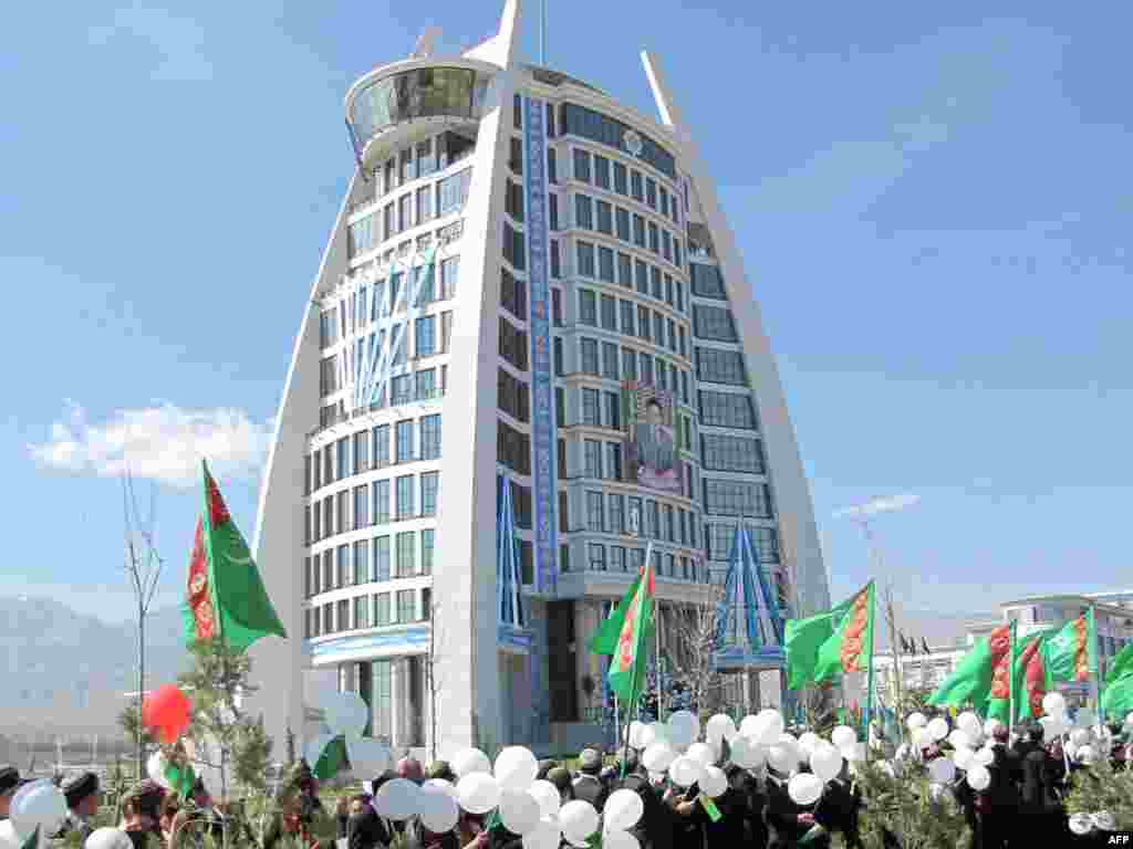 Young people carrying white balloons attend a 2011 inauguration ceremony for a public building recently erected in the Turkmen capital. The color white is frequently associated with cleanliness and good fortune in Central Asia.