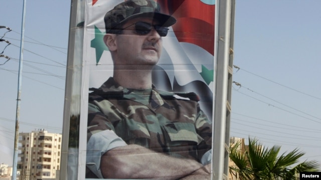 A picture of President Bashar al-Assad at one of the entrances of Homs city on June 13.
