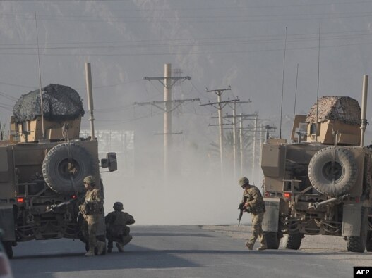 U.S. soldiers keep watch during gunfire near a U.S. base in Kandahar on October 27.