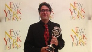 Radio Farda reporter Vahid Pourostad after receiving the New York Festivals' Silver Award, 17Jul2013.
