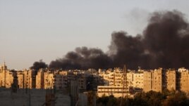 Heavy smoke covers the skyline of Aleppo after a bombing run by Syrian aircraft on September 24.