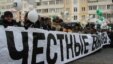 Protesters gather behind a banner reading "Honest Elections" during a demonstration in Moscow on February 4.