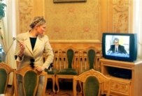 Yulia Tymoshenko watching Yushchenko deliver the speech in which he explained his decision to dismiss her on September 8, 2005 (AFP)