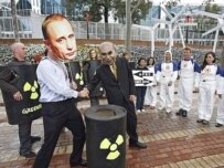 Greenpeace activists protesting the deal (AFP)