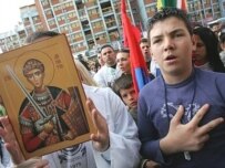 Kosovar Serbs showing public support for the Serbian national anthem in February (AFP)