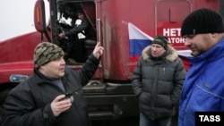 Dozens of long-distance truckers set up protest camps on the outskirts of Moscow to protest a new Kremlin-sanctioned road-levy, which they say amounts to highway robbery.