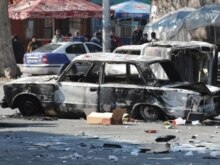 Armenia -- A burnt-out car lays on a street in the captial Yerevan, 02Mar2008