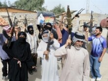 Iraq - Iraqi Shi'ite Sadrists shout slogans as they parade with their arms at an area on the outskirts of Baghdad's district of Al-Sadr City, 28Mar2008
