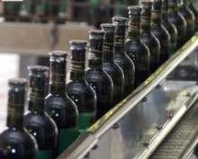 Georgia – Bottles of wine on a production line in Tbilghvino company, Tbilisi, Aprl 11,2006