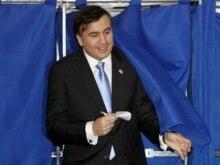Georgia - Presidential candidate Mikheil Saakashvili exits a polling-booth at a polling station in Tbilisi, 05Jan2008.