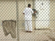 Cuba -- A detainee enters his cell in Camp Delta 4 at US Naval Base Guantanamo Bay, 09Oct2007