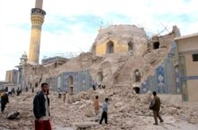 Iraq -- Iraqis step over the rubble of the holy 