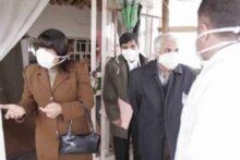 Iraq - Bird flu: Government officials wearing protective face masks in the village of Sulimaniya, after a case of bird flu was detected here, 4 Feb. 2006.