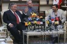 Iran -- Iraqi President Jalal Talabani (left) with Iranian President Mahmud Ahmadinejad in Tehran, 27Nov2006 (translator in center)