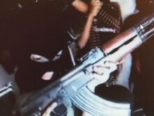 Iraq -- An image grab taken from an Al-Qaeda training video shows children carrying guns and being trained in Iraq, undated