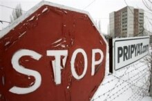 Ukraine -- A view of a housing project in the ghost town in of Prypyat (road sign) near Chornobyl's nuclear power plant 27 Feb. 2006