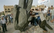 Iraq - Iraqis gang up on the fallen statue of Saddam Hussein, Baghdad, 18May2003
