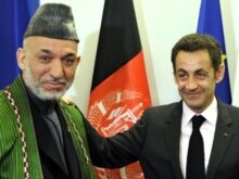 Romania -- French President Nicolas Sarkozy (R) and his Afghan counterpart Hamid Karzai at the NATO summit in Bucharest, 03Apr2008