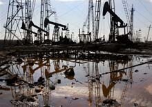 Azerbaijan -- Caspian oil derricks, pollution