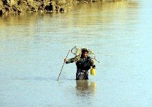 Afghanistan -- An Afghan fisherman tries his luck near the northern Afghan port of Heiraton where humanitarian aid arrived from the southern Uzbek town of Termez by a barge crossing the Amu Darya river, 13 Dec. 2001