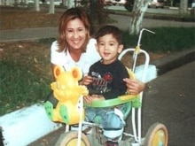 Uzbekistan -- Umida Niyazova, journalist and human rights activist, with her son, undated