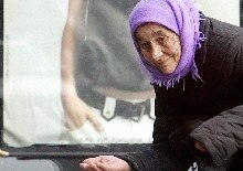 Ukraine -- An elderly woman begs for alms on the eve of Women's day, Kyiv 7 Mar. 2006