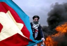 Turkey – Kurds – A Turkish Kurd holds a Kurdistan Workers Party (PKK) flag at a demonstration in Istanbul, 19 March 2006. (Size:220x155.) Source: epa.