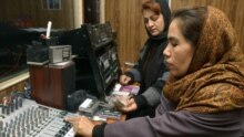 Afghanistan -- Two Afghan women work in a studio of the first radio station in Afghanistan to be dedicated to the interests of women in Kabul, 26 Jan. 2005