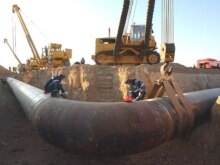 Gazprom welders work at the pipe during the construction works on the pipeline Middle Asia - Center in Aleksandrov Gai village at the border between Kazakhstan and Russia, 13Sep2007