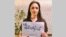 Taraneh Alidoosti holds a sign with the slogan "Woman, life, freedom."