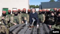 NATO Secretary General Jens Stoltenberg visits a training program for the Ukrainian Armed Forces at Lydd Army Camp in the United Kingdom on November 11. 