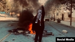 A women chants against the government in a protest in the western Iranian city of Marivan on November 6.