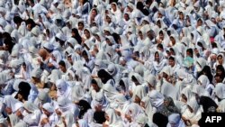 Students in Peshawar pray for the recovery of 14-year-old education-rights activist Malala Yousafzai on October 12, three days after she was shot by Taliban gunmen on a school bus.