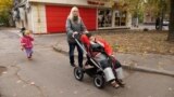 Anastasia Borysova walking with her son and daughter in Odesa