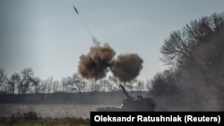 Ukrainian soldiers fire a Polish self-propelled Krab howitzer toward Russian positions in the Donetsk region on November 8.
