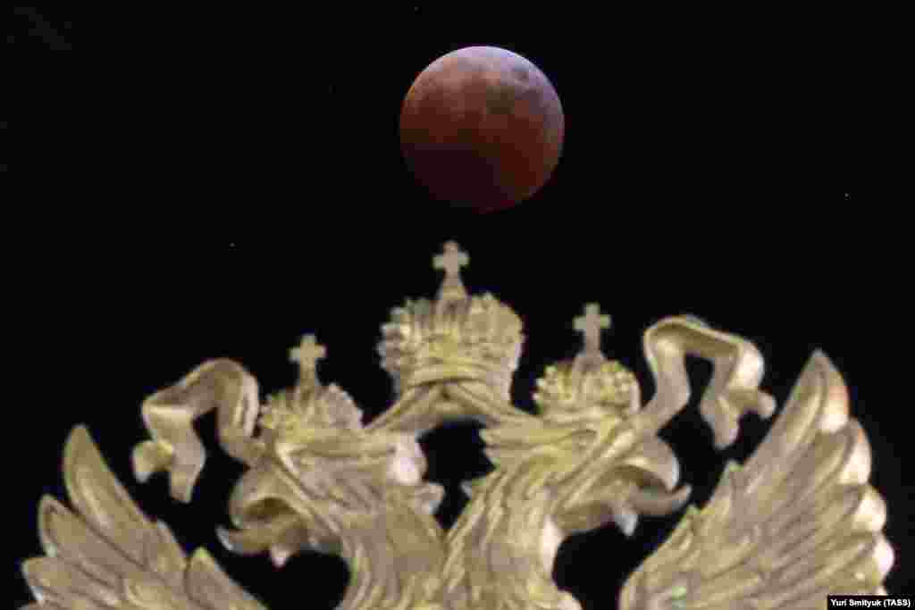 A partial eclipse phase of a total lunar eclipse is seen at night from Vladivostok, Russia, on November 8.