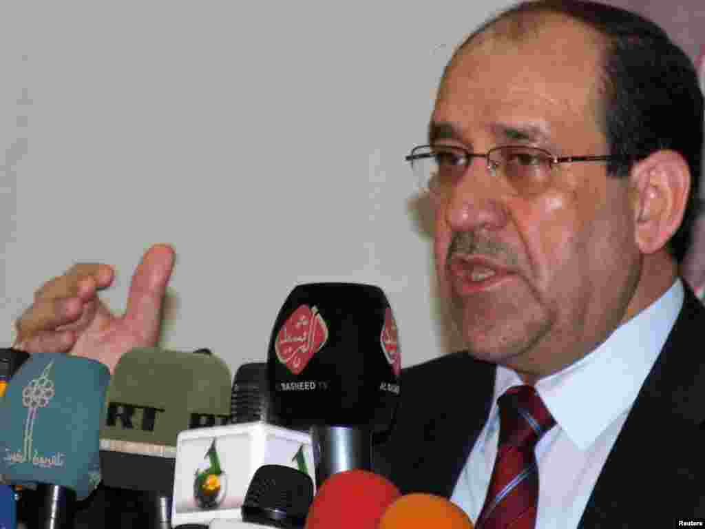 Iraq -- Prime Minister Nuri al-Maliki speaks during a conference on the readiness of the Iraqi army before a full US withdrawal by the end of 2011, in Baghdad, 12Aug2010 - Iraq's Prime Minister Nuri al-Maliki speaks during a conference about the readiness of the Iraqi army before a full U.S. withdrawal by the end of 2011, at the Iraqi Defence Ministry headquarters in Baghdad August 12, 2010. REUTERS/Stringer (IRAQ - Tags: CONFLICT POLITICS MILITARY)