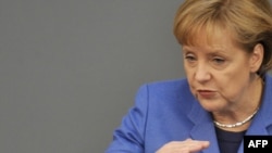 German Chancellor Angela Merkel addresses the Bundestag in Berlin on March 25.