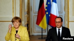 Канцлер Німеччини Ангела Меркель (Л) і президент Франції Франсуа Олланд 