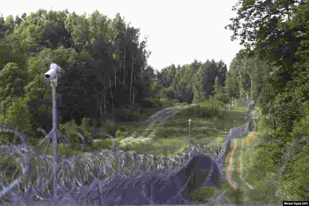 Security cameras and rolls of razor wire top a fence where the borders with Poland, Lithuania, and Russia&rsquo;s Kaliningrad exclave meet. The photo was taken from near the Polish village of Zerdziny in July.&nbsp; &nbsp;