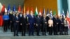 Germany's Chancellor Olaf Scholz, European Commission President Ursula von der Leyen and other attendees pose for a family photo at the Western Balkans Summit at the Chancellery in Berlin on November 3.