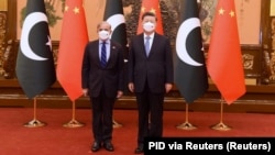 Pakistan's Prime Minister Shehbaz Sharif (left) meets Chinese President Xi Jinping in Beijing on November 2.