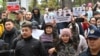 Demonstrators protest a controversial border deal with Uzbekistan in Bishkek on October 24.