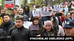 Demonstrators protest a controversial border deal with Uzbekistan in Bishkek on October 24.