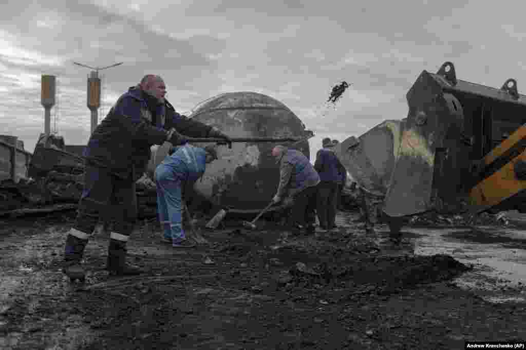 Workers at the fuel depot in Kalynivka are still cleaning up months later. &nbsp;