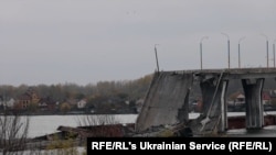 Several spans of the main Kherson bridge across the Dnieper River are completely destroyed.
