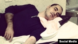 Hossein Ronaghi has been transferred to a hospital after refusing to eat for 64 days, his father said.