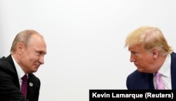 Then-U.S. President Donald Trump (right) and Russian President Vladimir Putin hold a bilateral meeting at the G20 summit in Japan in June 2019.